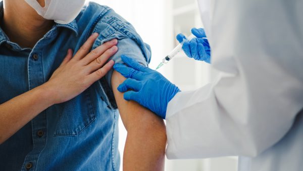Medical professional administering a vaccine