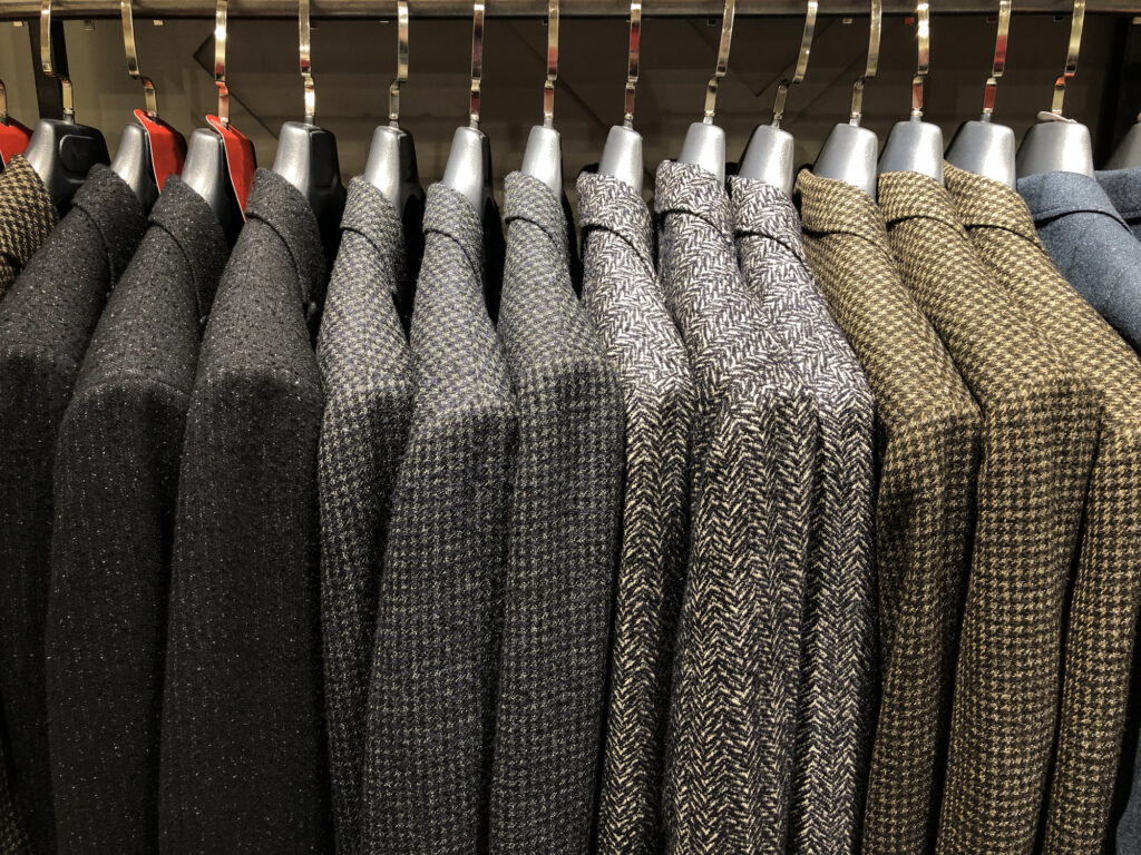 Many suits on rack