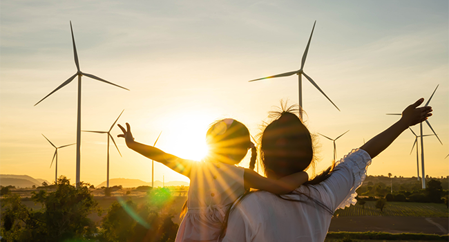People wind turbine and sunset
